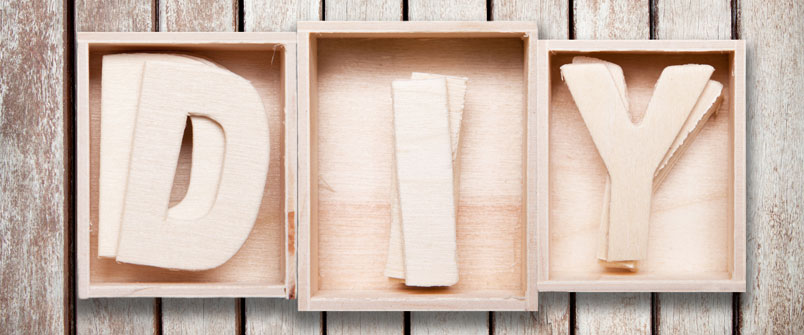 Photo of wood in boxes spelling "DIY"
