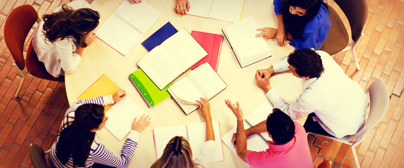 Overhead view of group studying at a table