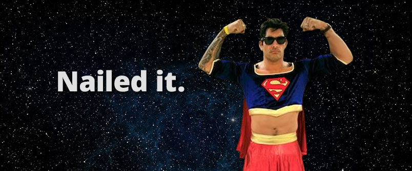 A guy dressed as Supergirl floating in space with the words "Nailed it" next to him