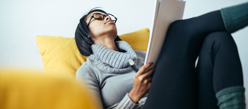 Girl relaxing and reading notes