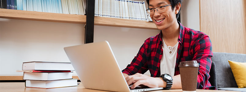 College student on his laptop