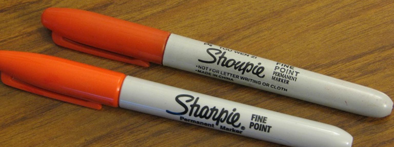 Real Sharpie marker next to a counterfeit "Shoupie" marker